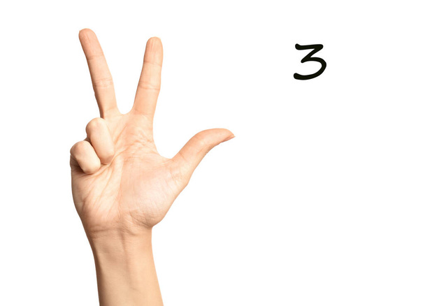 Woman showing number three on white background, closeup. Sign language - Valokuva, kuva