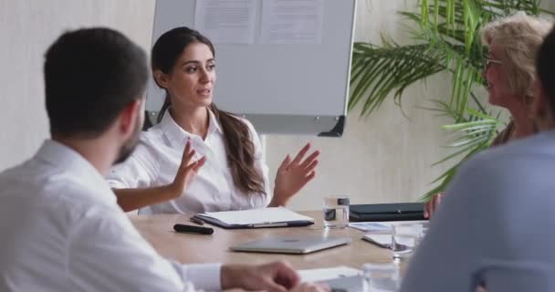 Motivated millennial businesswoman briefing employees on project. - Video, Çekim