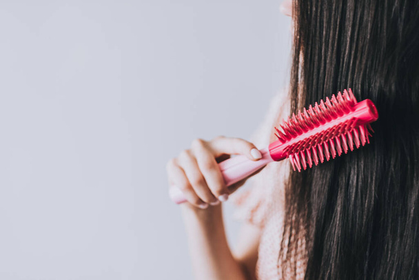  Young Woman Brushing Her Long Hair With Comb.  - Photo, Image