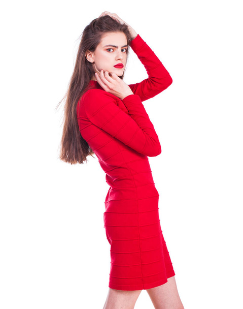 Close up portrait of a young beautiful girl in red dress - isolated on white background - Photo, image