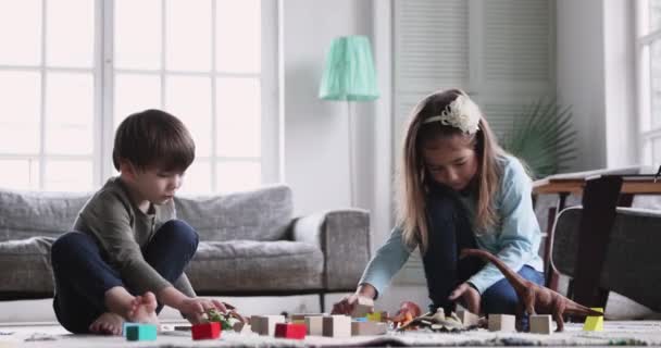 Smiling small children siblings involved in funny game. - Video, Çekim