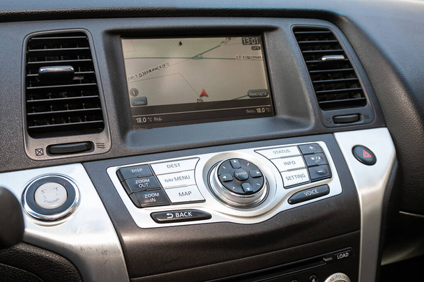 Novosibirsk/ Russia  May 03 2020: Nissan Murano,car dashboard audio in FM-receiver, CD, volume control knobs, switching between songs and other buttons   - 写真・画像