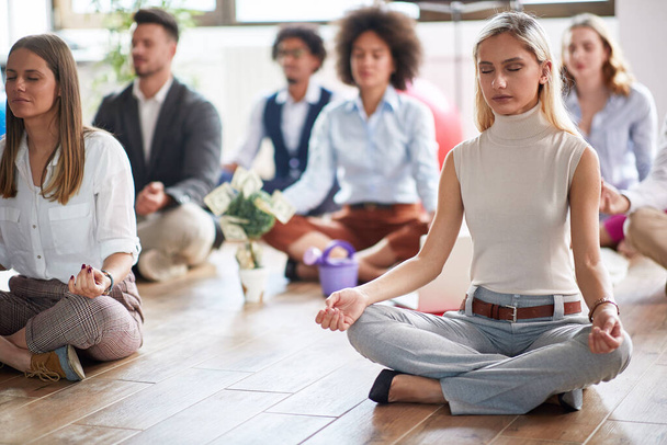 Office money attraction meditation, meditation and business, young people meditating in the office - Foto, Bild