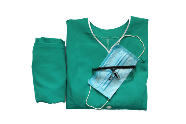 медична уніформа, складена на ізольованому фоні медсестра
 - Фото, зображення