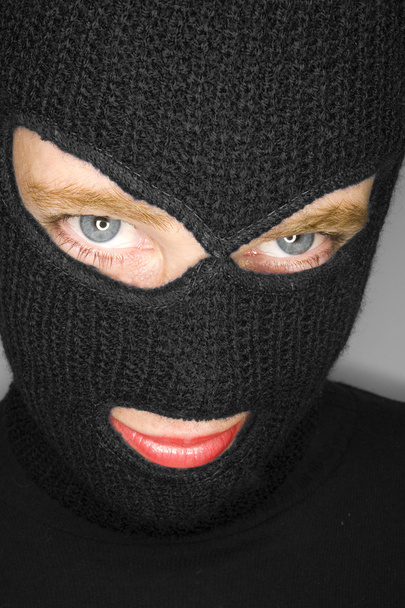 A stock photograph of an attractive woman wearing a balaclava. - Photo, Image