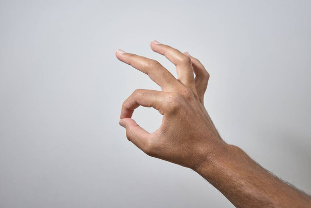 hand with OK sign on white background - Φωτογραφία, εικόνα