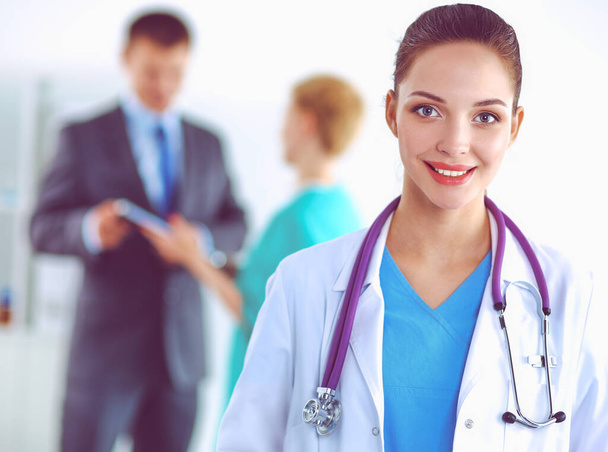 Woman doctor standing at hospital - Foto, imagen