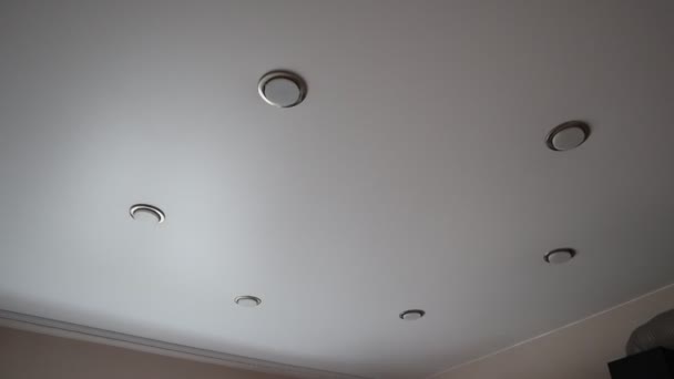 Stretch ceiling. Light on the stretch ceiling. Turn on and off the light - Footage, Video