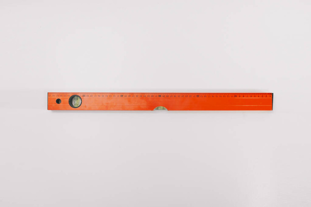 Ruler level on a white background isolation. Copy space on top. Construction Tools Sale Concept. - Фото, изображение