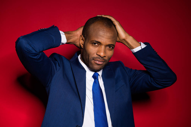 Closeup photo of handsome attractive dark skin business guy hold arm on head look mirror check new hairstyle wear blue formalwear suit tuxedo isolated vivid burgundy background - Photo, Image