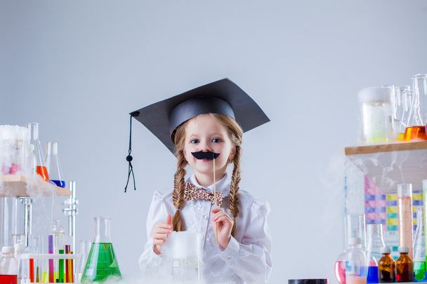 Merry little scientist posing with fake mustache - 写真・画像