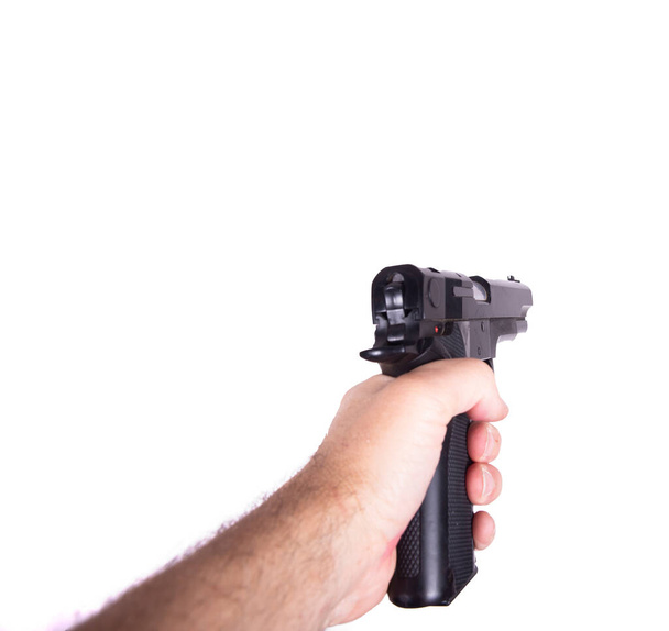 gewapende hand punt vijand in de witte achtergrond in eerste zicht - Foto, afbeelding
