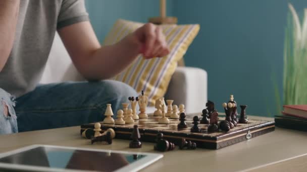 Man Is Playing Wooden Man-Carved Chess Alone - Video, Çekim