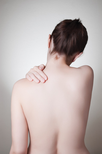 Mulher com dor nas costas
 - Foto, Imagem