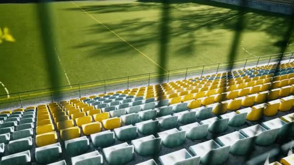 The stadium is fenced with an iron fence. Empty seats in the stadium without spectators and fans. Cancellation of matches due to the coronavirus pandemic, quarantine. Access is closed. World Cup and European Football Championship canceled. - Footage, Video