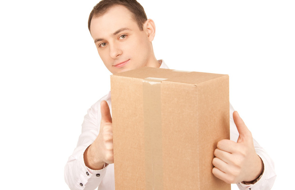 Businessman with parcel - Foto, afbeelding
