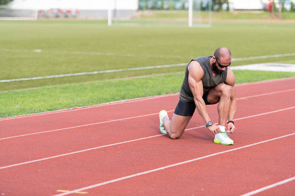 Athlete Guy Trying Running Shoes Getting Ready for Jogging - Photo, Image