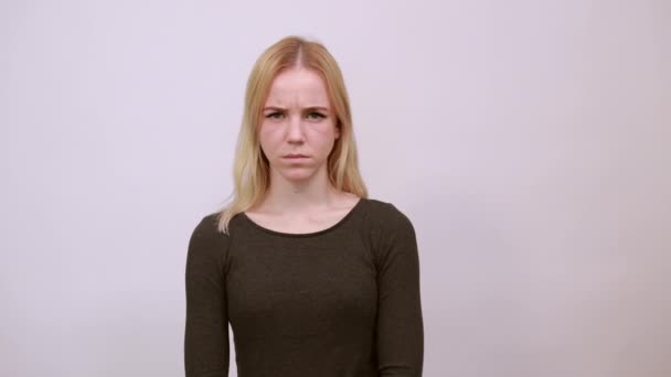 Offended Girl Holds Hand To Her Chin. Concept Of Relationships Between People - Footage, Video