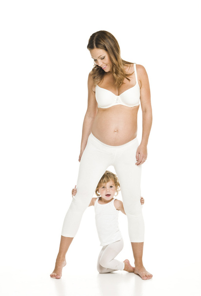 Mulher grávida com sua filha
 - Foto, Imagem