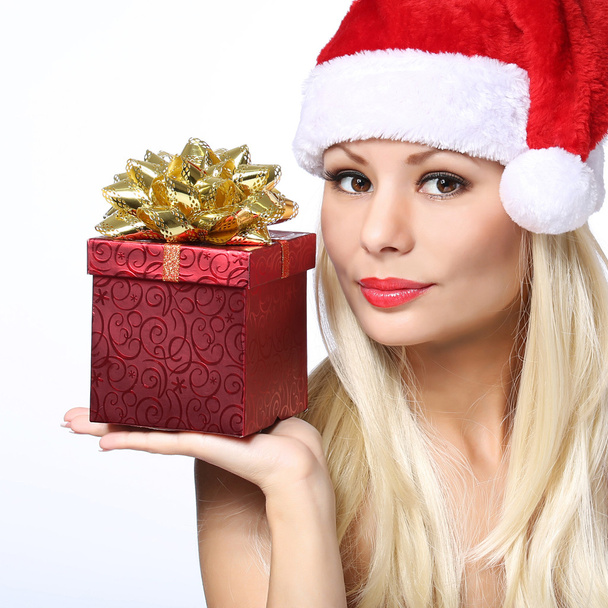 Christmas Woman with Gift Box. Beautiful Blonde Girl in Santa Hat - Photo, image