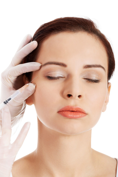 Beautiful woman's face is being prepareg to plastic surgery. - Valokuva, kuva