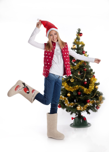 girl in boots in Christmas tree - Fotoğraf, Görsel