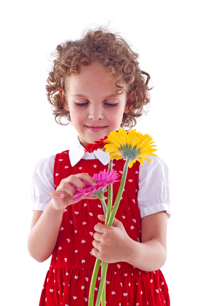 Girl sniffs some flowers - Foto, imagen