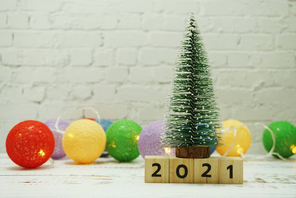 Happy New Year 2021 festive background with christmas tree on white brick wall background - Foto, Imagen