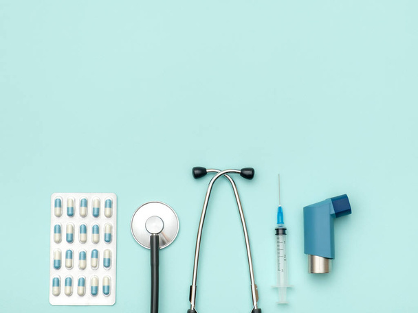 Flat lay of medical tools on colored background. Healthcare insurance concept. Table top view essential doctor's equipment - Photo, Image