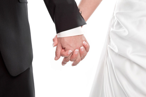 Wedding couple holding hands isolated on white. - Foto, imagen