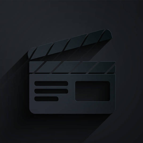 Paper cut Movie clapper icon isolated on black background. Film clapper board. Clapperboard sign. Cinema production or media industry. Paper art style. Vector Illustration - Vector, Image