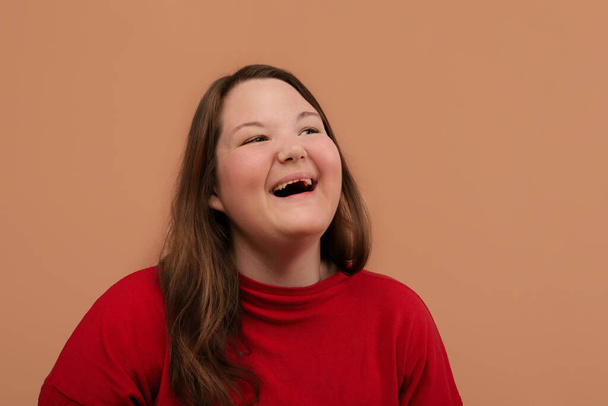 Laughing girl with a big face. An overweight girl. - Foto, Bild