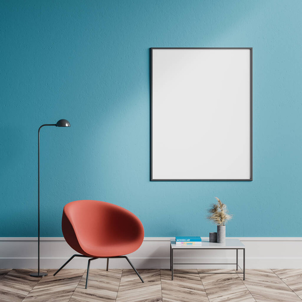 Interior of minimalistic living room with blue walls, wooden floor, comfortable orange armchair standing near square coffee table with vertical mock up poster above it. 3d rendering - Foto, Imagen