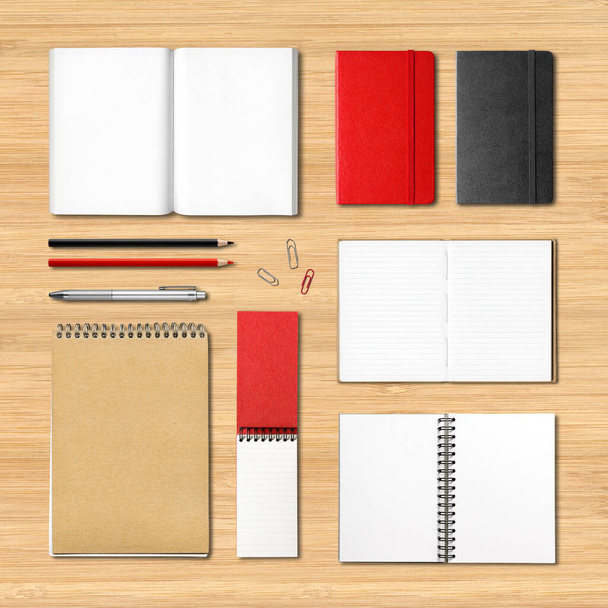 stationery books and notebooks mockup template isolated on wooden desk background - Foto, afbeelding