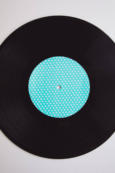 Black vinyl arranged on a white background seen from above - Photo, Image