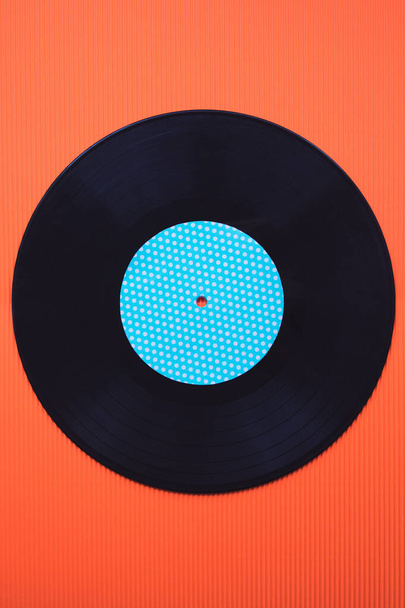 Black music vinyl on a red background top view - Photo, Image