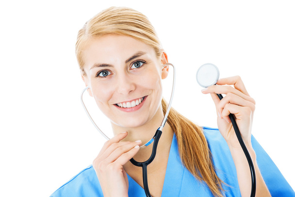 verpleegkundige bedrijf stethoscoop op witte achtergrond - Foto, afbeelding