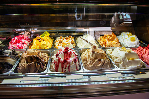 Ice cream in Rome, Italy. Italian gelateria. Ice-cream cafe, show window with sweeties. - 写真・画像