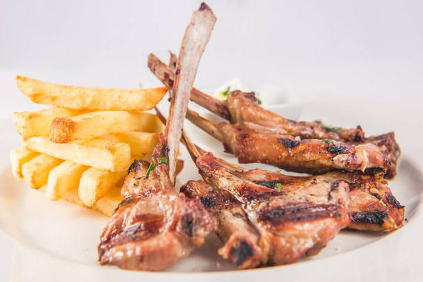 Lamb chops with rosemary and chips - Photo, Image