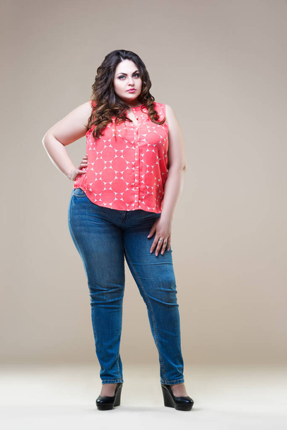 Plus size fashion model in casual clothes, fat woman on beige background, body positive concept - Fotografie, Obrázek
