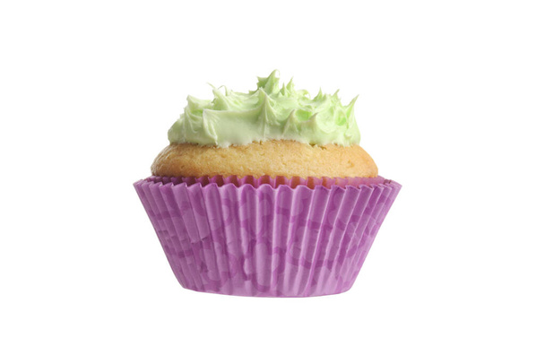 isolated cupcake with green frosting - Фото, изображение