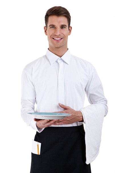 Professional waiter holding an empty dish. Isolated on white - Photo, Image
