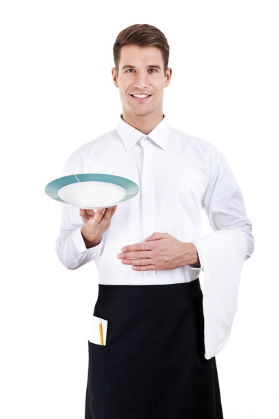 επαγγελματίας σερβιτόρος κρατώντας ένα άδειο πιάτο. απομονωθεί σε λευκό - Φωτογραφία, εικόνα