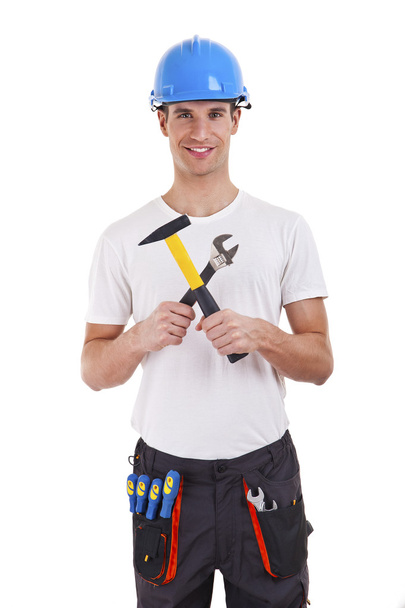 builder in a helmet over white background - Foto, afbeelding