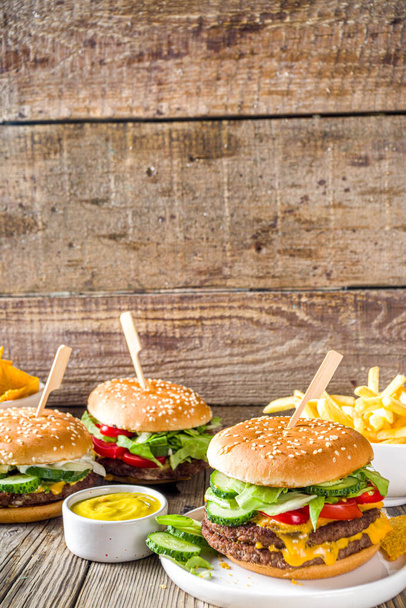 Homemade burgers on wooden background - Photo, Image