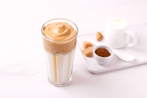 whipped dalgona coffee with milk and cane sugar. trendy South Korean cold summer drink - Fotoğraf, Görsel