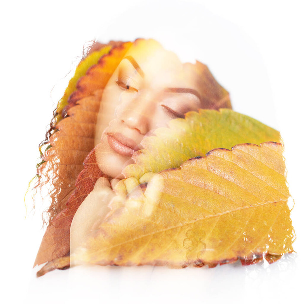 Double exposure portrait of beautiful young african woman and fall leaves isolated on white background. Autumnal seasonal concept design element - Fotoğraf, Görsel