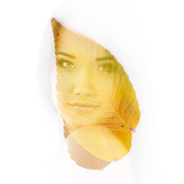 Double exposure portrait of beautiful young woman and fall leaves isolated on white background. Autumnal seasonal concept design element - Foto, Imagen