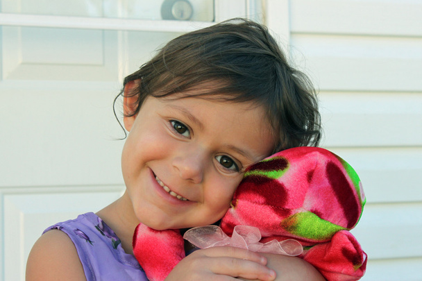 Rapariga com seu bicho de pelúcia
 - Foto, Imagem