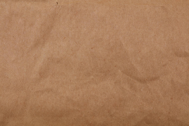 Κινηματογράφηση σε πρώτο πλάνο του καφέ χαρτί υφή φόντου - Φωτογραφία, εικόνα